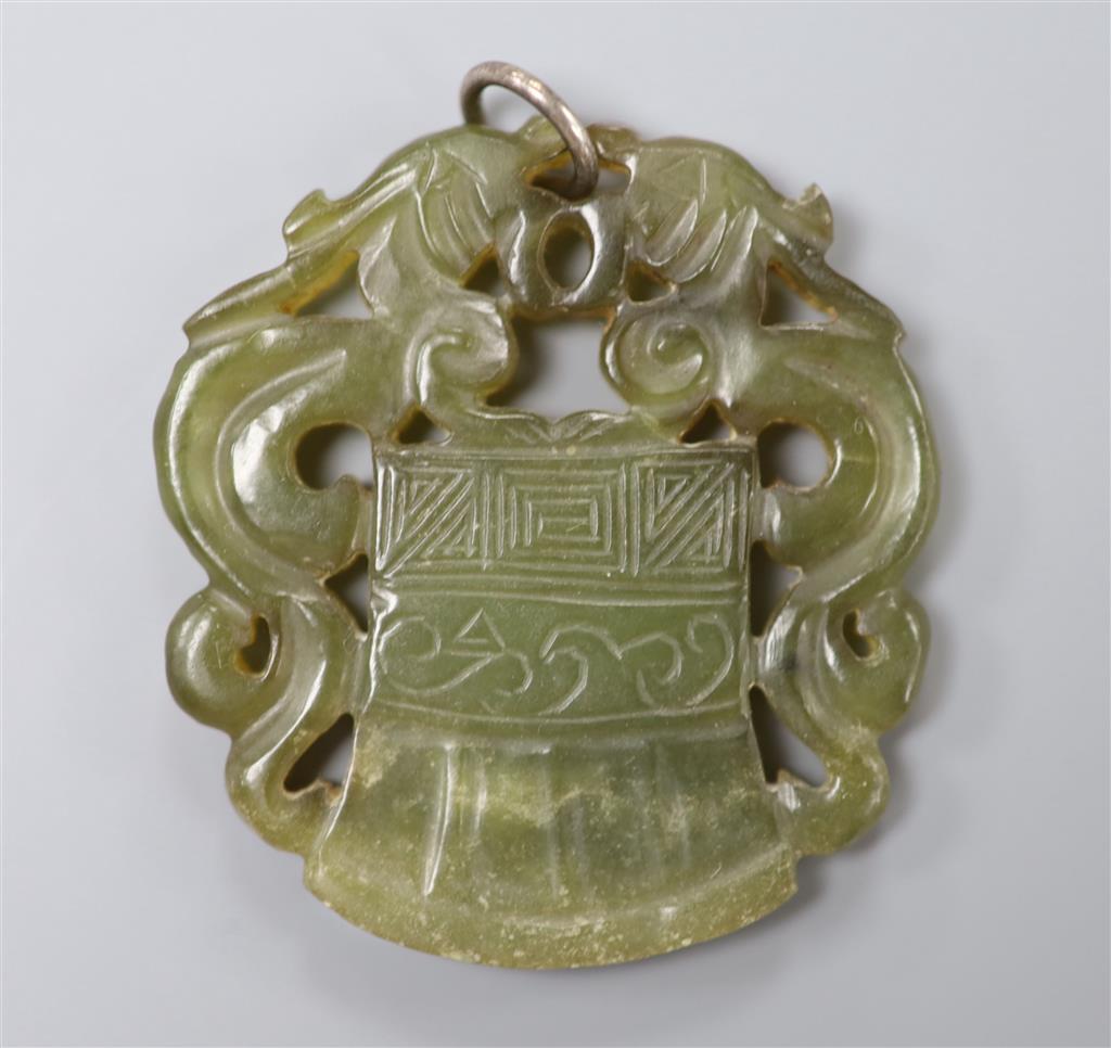 A Chinese carved bowenite pendant, 54mm.